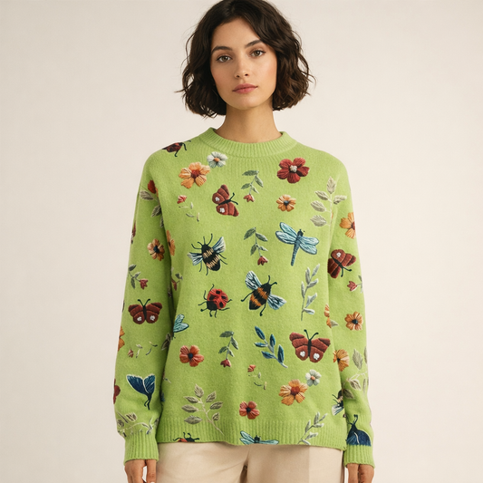 Strikket pullover til kvinder med dekorativt blomster- og insektprint