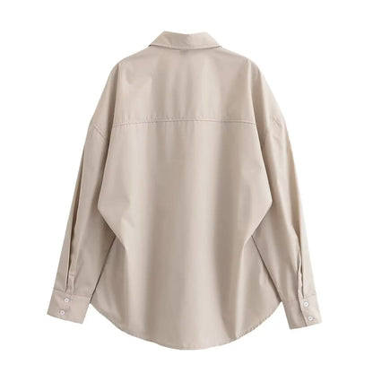 Elegant langærmet skjorte med justerbar talje og afslappet silhuet