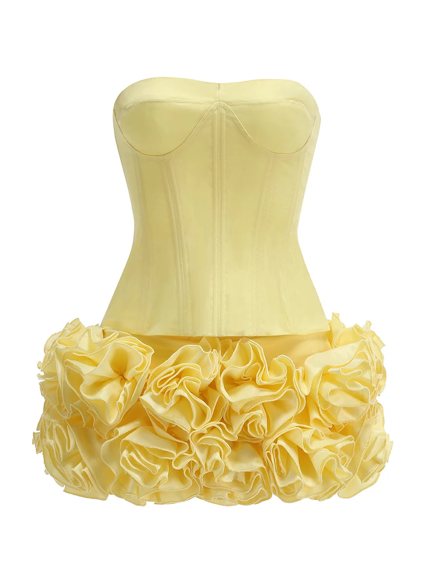 Stropløst to-delt fest­sæt | Skulpturel top | Blomsterfoldet mininederdel