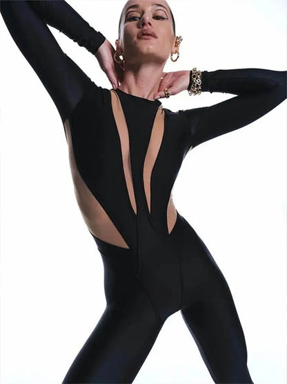 Figursyet jumpsuit med lange ærmer og transparente detaljer