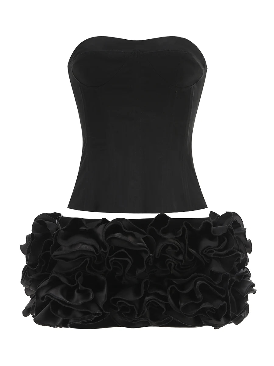 Stropløst to-delt fest­sæt | Skulpturel top | Blomsterfoldet mininederdel