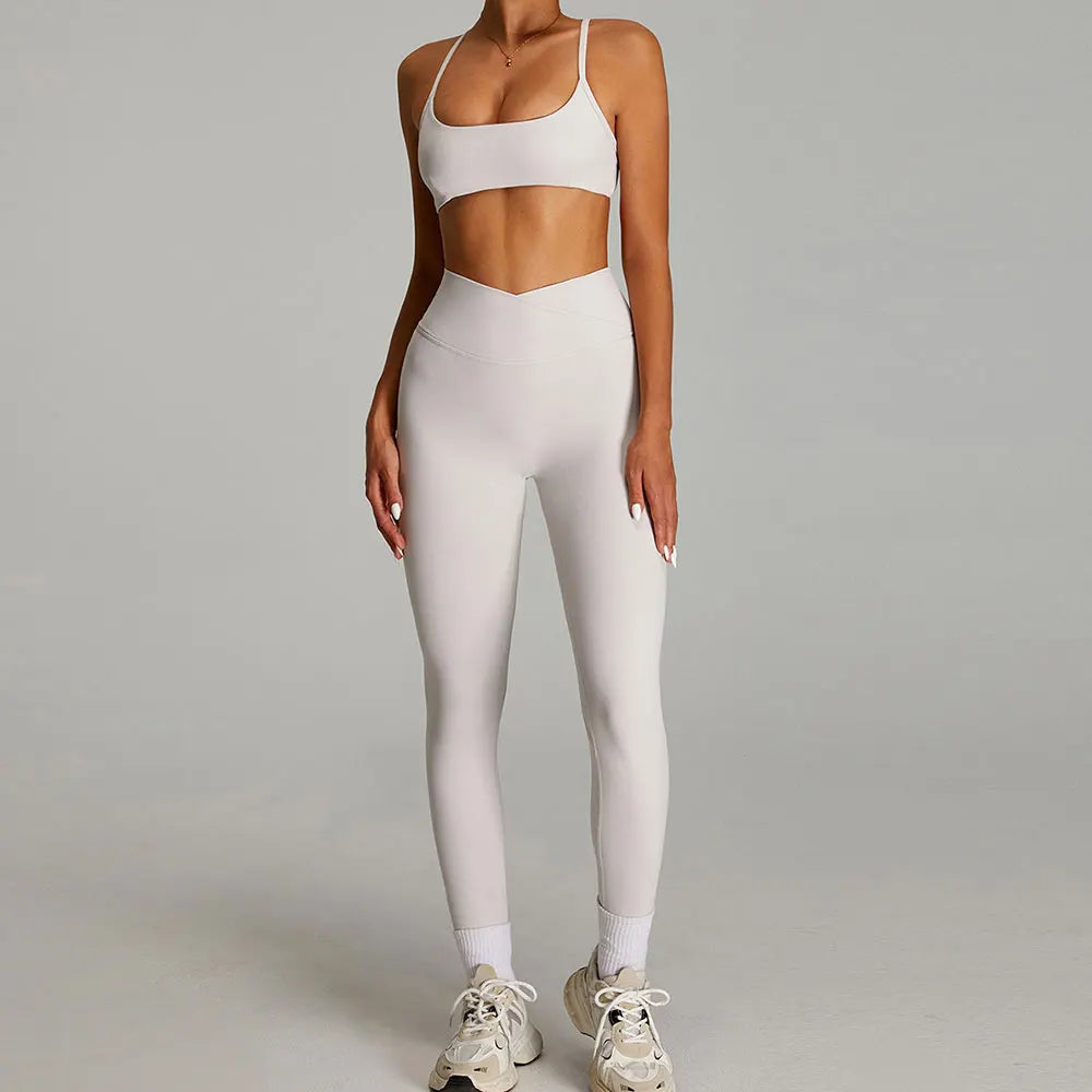 Figurformende yogasæt med støttende sports-bh og højtaljede leggings til kvinder