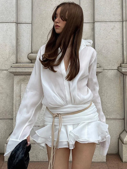 Elegant sort skjorte med taljedetalje | Langærmet bluse med slå-om effekt