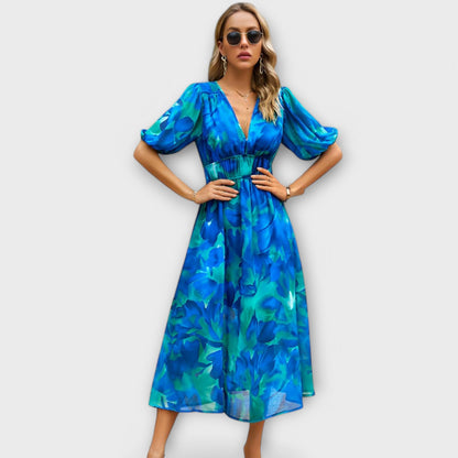 Elegant maxi kjole med abstrakt print og puffærmer